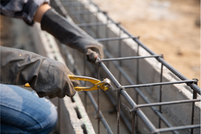 Concrete construction with metal and metal cutters